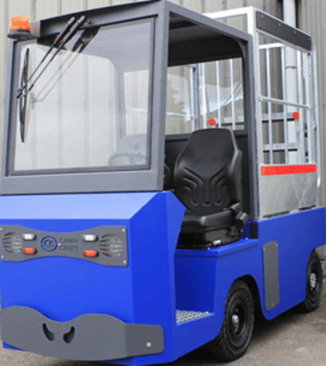 Porteur électrique bleu Carry Craft avec cabine vitrée, siège conducteur et structure arrière grillagée